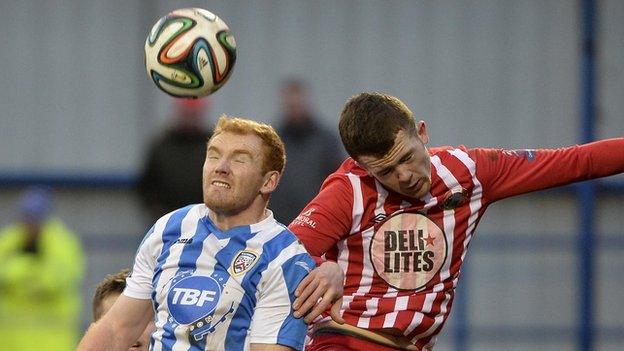 Coleraine's Joe McNeill and Warrenpoint's Ciaran O'Connor