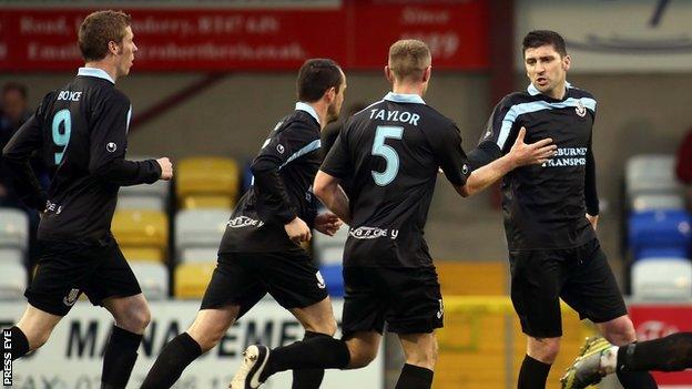 Ballymena players congratulate Davy Munster after he scored the opening goal