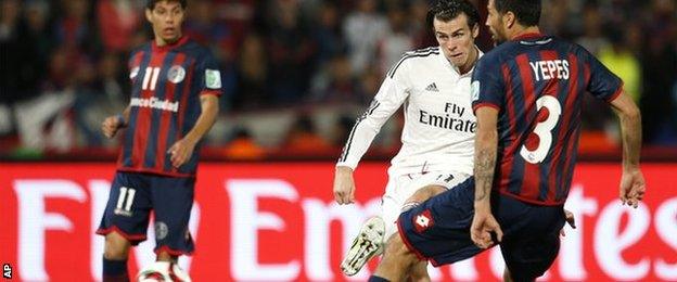 Real Madrid forward Gareth Bale scores for his side against San Lorenzo