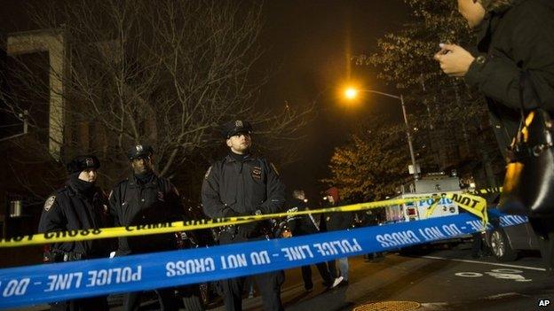 Police guard the scene where two NYPD officers were shot on 20 December 2014 in New York