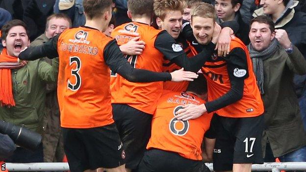 Stuart Armstrong celebrates after scoring for Dundee United against Celtic