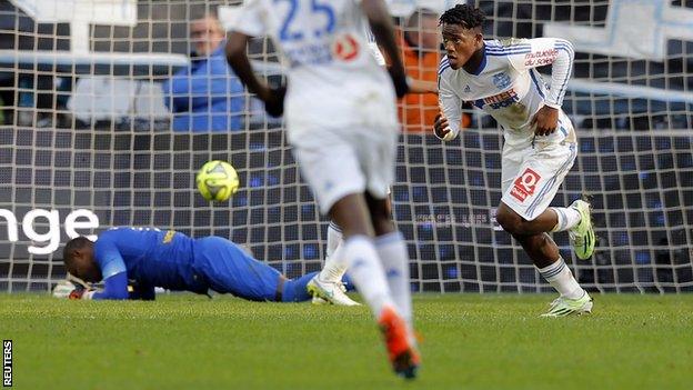 Marseille forward Michy Batshuayi (right) wheels away to celebrate his side's winner against Lille