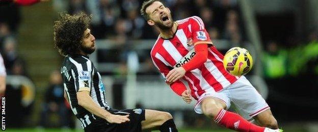 Newcastle's Fabricio Coloccini and Sunderland's Steven Fletcher