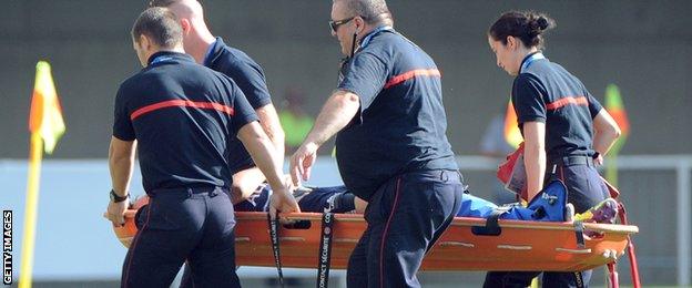 A player is stretchered off