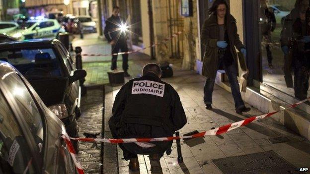 Police at the site where a driver targeted pedestrians in Dijon