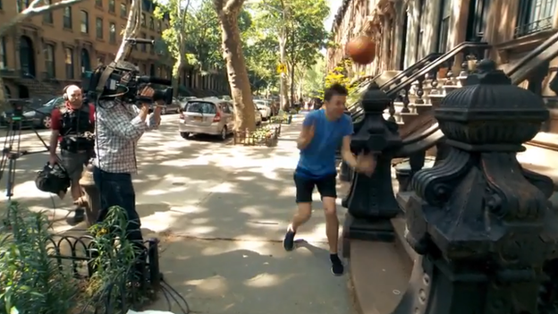 Basketball bouncing off a man's head