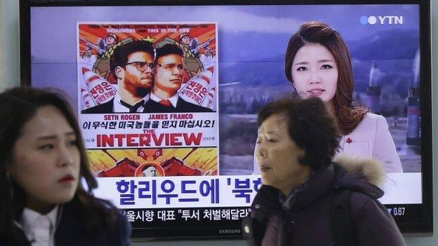 TV screen in Seoul showing news report of film The Interview. 22 Dec 2014