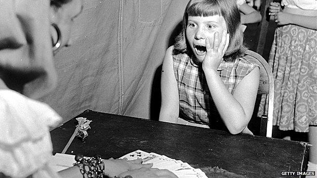 Fortune teller with surprised girl