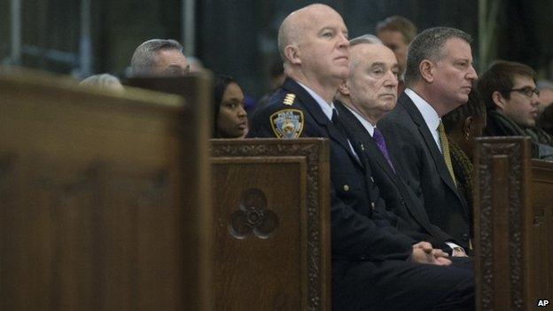 Bratton (centre) and De Blasio (right) attended a church memorial service