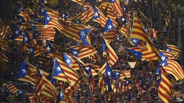 File photo: Catalan pro-independence flags are waved during celebrations of Catalonia National Day in Barcelona, 11 September 2014