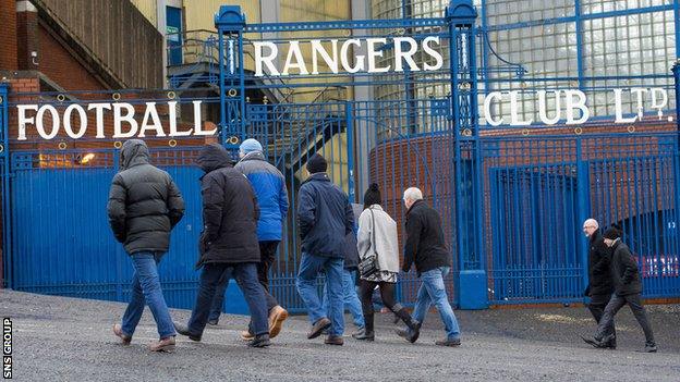 Rangers fans turn up at a wet Ibrox for the club's annual general meeting