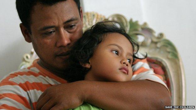 In this file photo, Mustafa is reunited with his daughter Rina