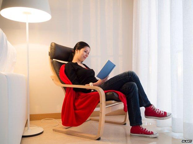 Woman reading book alone