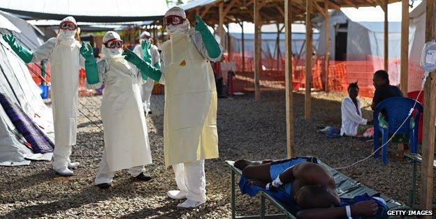 People dressed in protection suits, Sierra Leone