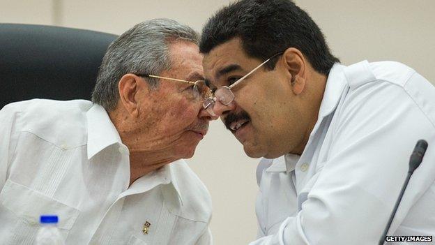 Cuban President Raul Castro and Venezuelan President Nicolas Maduro speak.