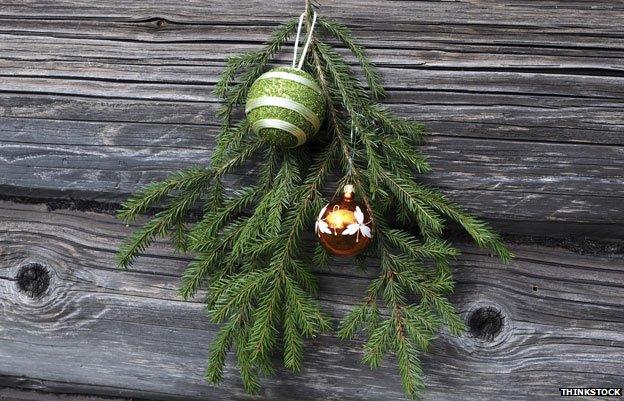 Christmas decorations on a wooden house