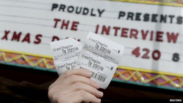 Tickets for The Interview held up outside Crest Theatre in Los Angeles, California. 24 Dec 2014