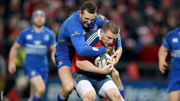 Leinster wing Dave Kearney battles with Munster try-scorer Andrew Conway