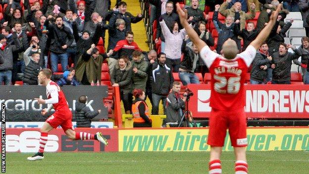 Charlton's players celebrate Johann Berg Gudnmunsson's equaliser