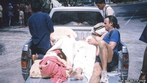 Injured people in the back of a pick-up truck