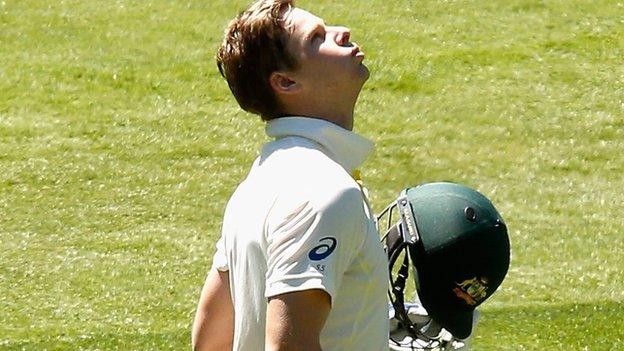 Australia captain Steve Smith looks to the sky after reaching 100 against India