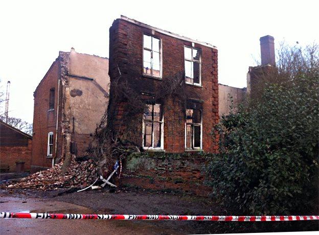 Exterior view of Hickling Hall after it was gutted by fire