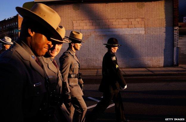 Police officers outside Christ Tabernacle Church in Queens, New York, 27 December