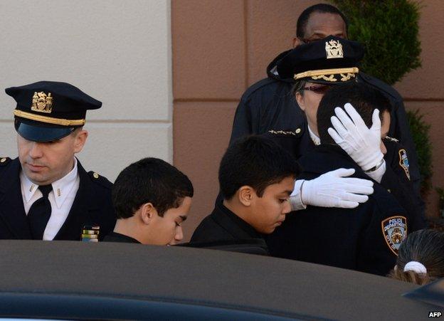 Ramos family members arrive for the funeral in New York, 27 December