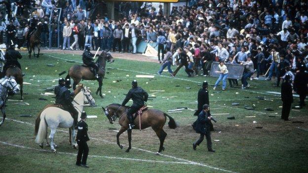 Football fans invade pitch at Birmingham v Leeds match on 11 May 1985