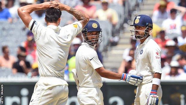 India batsmen Ajinkya Rahane (centre) and Virat Kohli (right) limited the impact of Australia pace bowler Mitchell Johnson