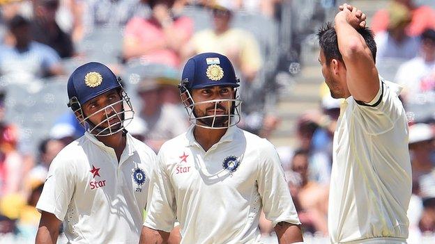 India batsmen Ajinkya Rahane (centre) and Virat Kohli (right) limited the impact of Australia pace bowler Mitchell Johnson