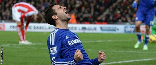 Cesc Fabregas celebrates scoring against Stoke City