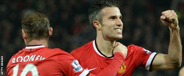 Manchester United's Dutch striker Robin van Persie (R) celebrates scoring their third goal with Manchester United's English striker Wayne Rooney (L) during the English Premier League football against Hull City on 29th Nov 2014.