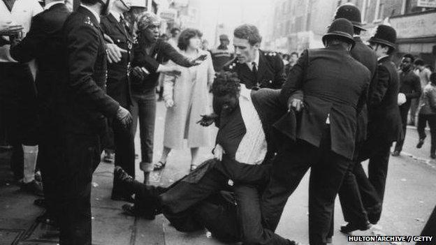 Police officers make an arrest in Brixton, London, 13th April 1981