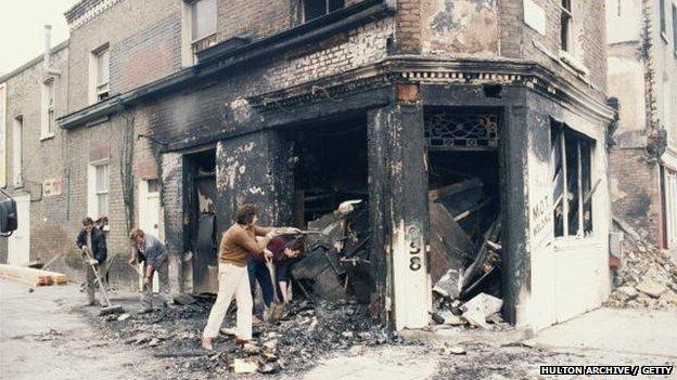 A burnt-out welding shop in Railton Road, Brixton, 13th April 198