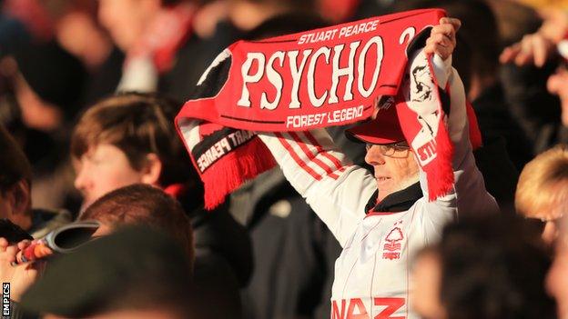 Fan holds a Stuart Pearce scarf up in support of the Nottingham Forest manager