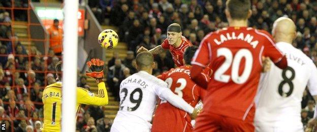 Martin Skrtel heads towards goal