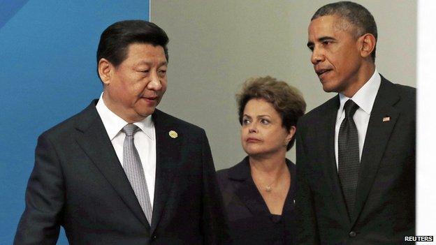 China's President Xi Jinping, Brazilian President Dilma Rousseff and US President Barack Obama arrive for a group photo of G20 leaders and representatives of partner groups at the annual G20 summit in Brisbane 15 November, 2014