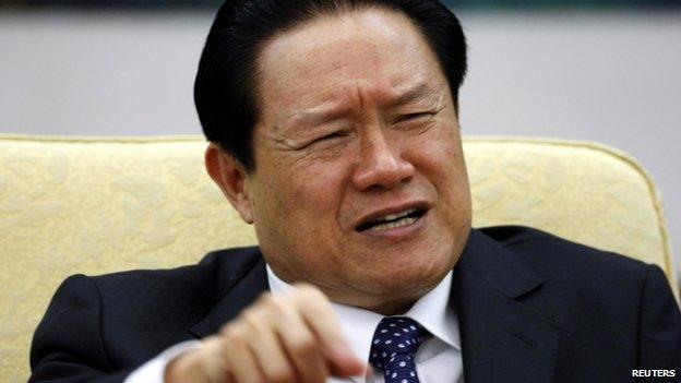 China's former Public Security Minister Zhou Yongkang gestures as he attends Hebei delegation discussion sessions of the 17th National Congress of the Communist Party of China in Beijing, in this 2007 file photo