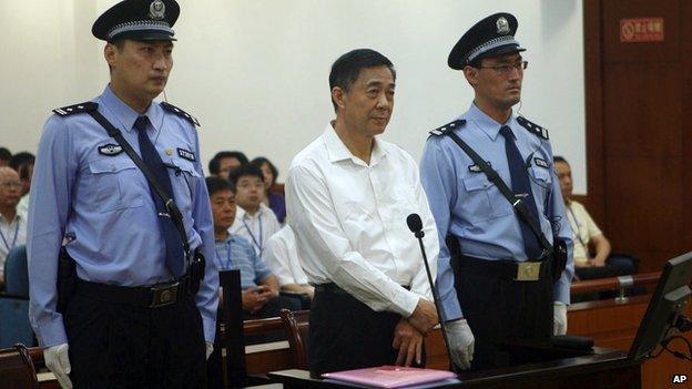 In this file photo released by the Jinan Intermediate People's Court, former Politburo member and Chongqing city party leader Bo Xilai stands on trial at the court in eastern China's Shandong province