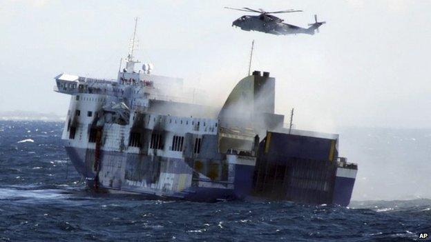 In this image released by the Italian Navy, smoke billows from the Italian-flagged Norman Atlantic that caught fire in the Adriatic Sea, Monday, Dec. 29, 2014