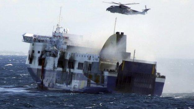 In this image released by the Italian Navy, smoke billows from the Italian-flagged Norman Atlantic that caught fire in the Adriatic Sea, Monday, Dec. 29, 2014