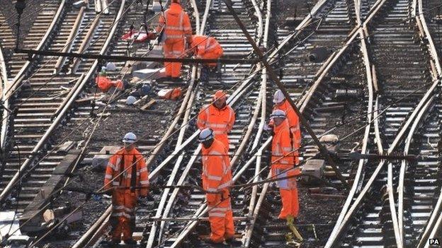 Railway workers on the tracks outside London King's Cross. Saturday 27 December 2014.