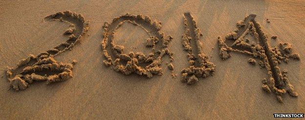 The number 2014 drawn on a beach