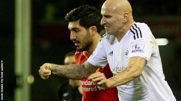 Jonjo Shelvey (R) of Swansea clashes with Emre Can (L) of Liverpool