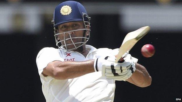 Indian batsman MS Dhoni plays a shot on day two of the second Test match between Australia and India at the Gabba in Brisbane, Australia, 18 December 2014