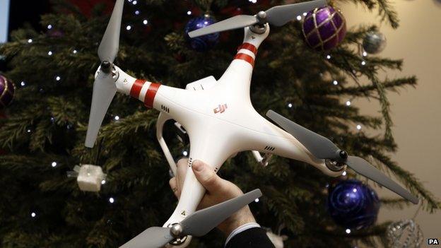 drone being taken from Christmas tree