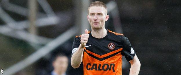 Chris Erskine celebrates after scoring for Dundee United against Dundee