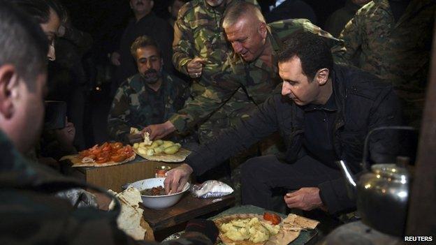 Syrian President Bashar al-Assad with troops in a Damascus suburb - 1 January