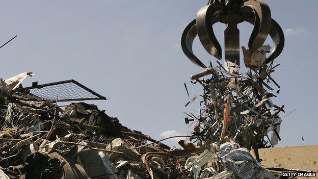 Knives from the amnesty being dropped into a scrapyard